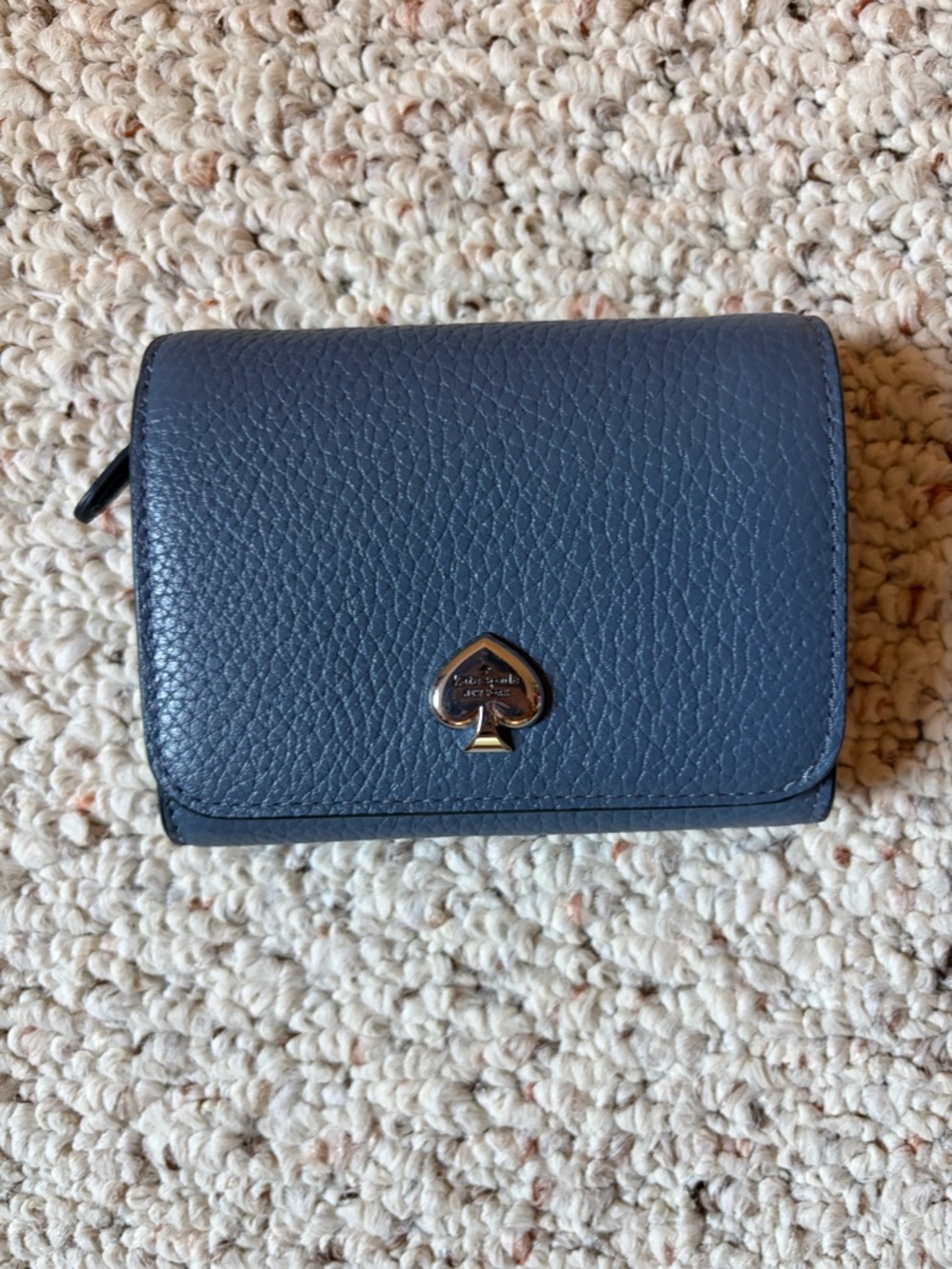 kate spade pebbled leather small wallet in navy with silver spade logo